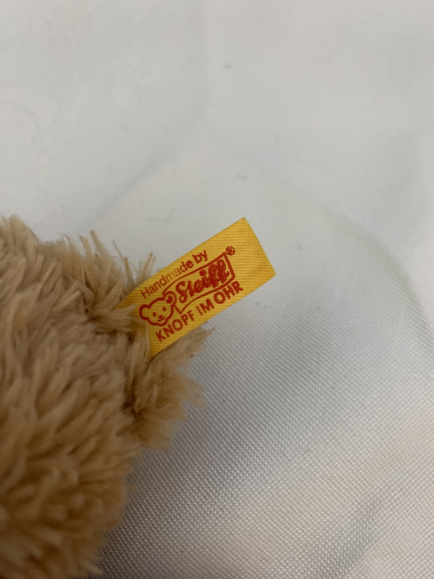 Steiff Schlaf-gut-Bär Greifring mit Rassel - hellblau